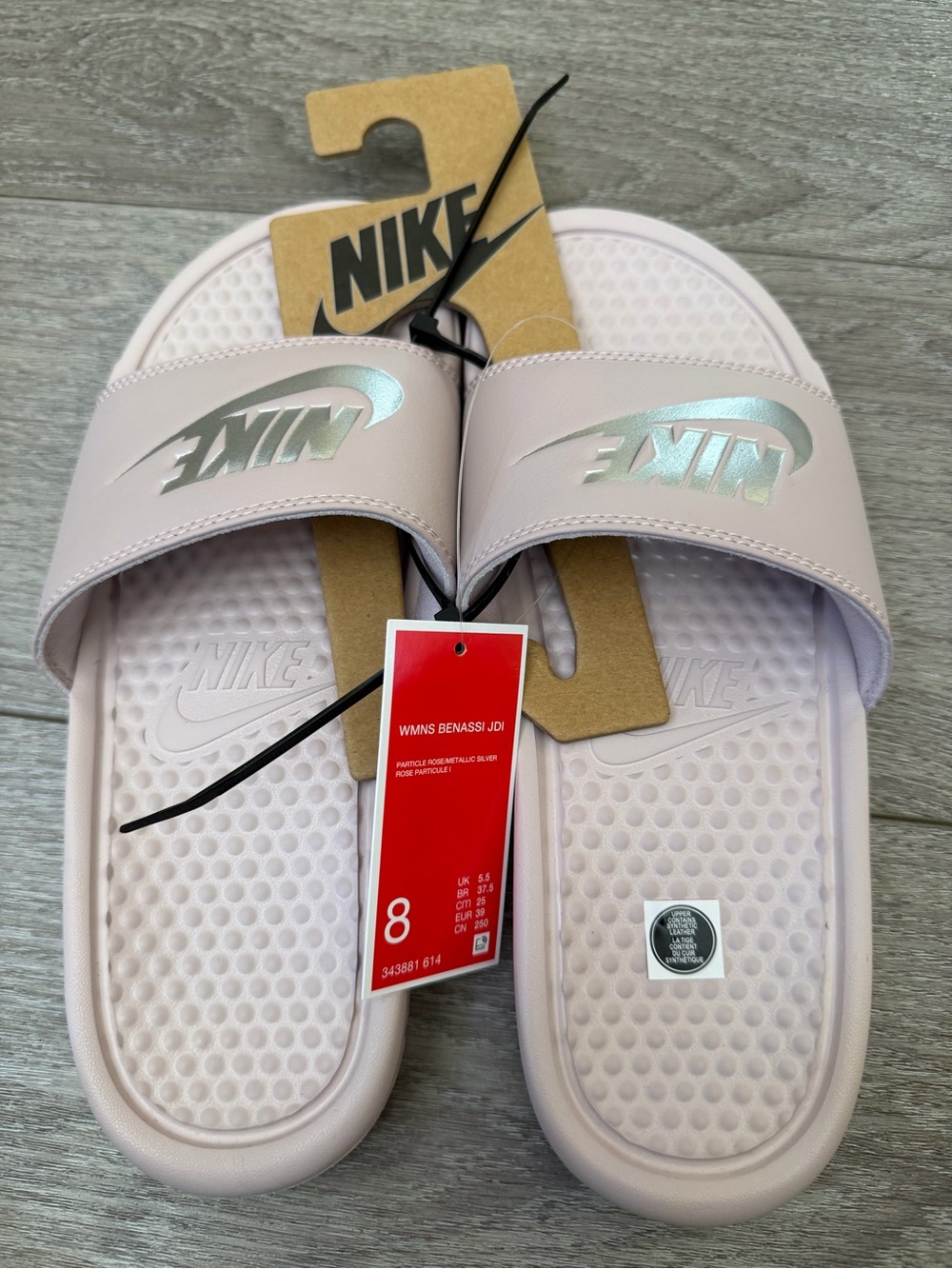 Nike Women's Slides in Pale Pink with Iridescent Logo